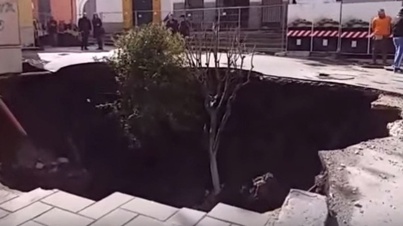 Car & trees swallowed up in yet another Italian sinkhole (VIDEO)