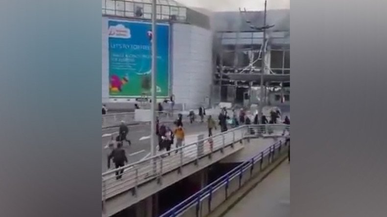 Terrified Brussels airport visitors flee terminal building after twin blasts (VIDEO)