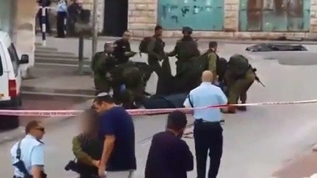 Video shows Israeli soldier greeting far-right activist after killing wounded Palestinian stabber