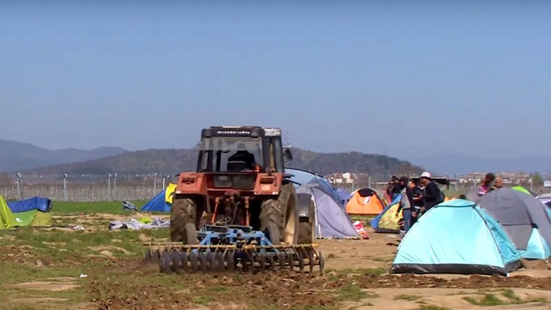Outraged Greek farmer plows tractor through refugee camp (VIDEO)