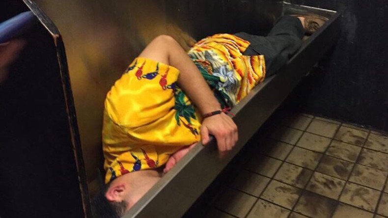 Taking the piss: Drunk student falls asleep in urinal (PHOTO)