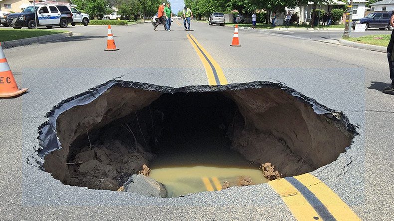 Traffic-stopping sinkhole devours California street (VIDEO)