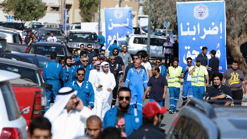 Thousands of Kuwait oil workers go on strike against pay cuts