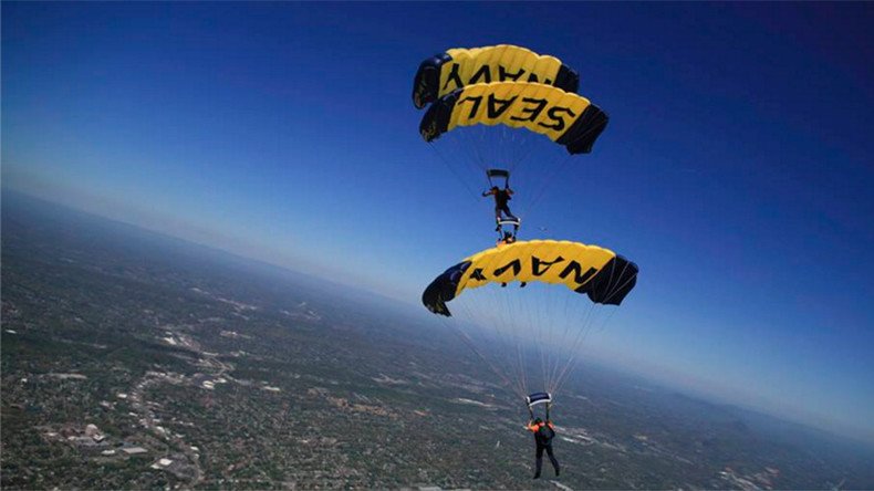 Navy Seals pull off heart-stopping parachute jump into packed stadium (VIDEO)