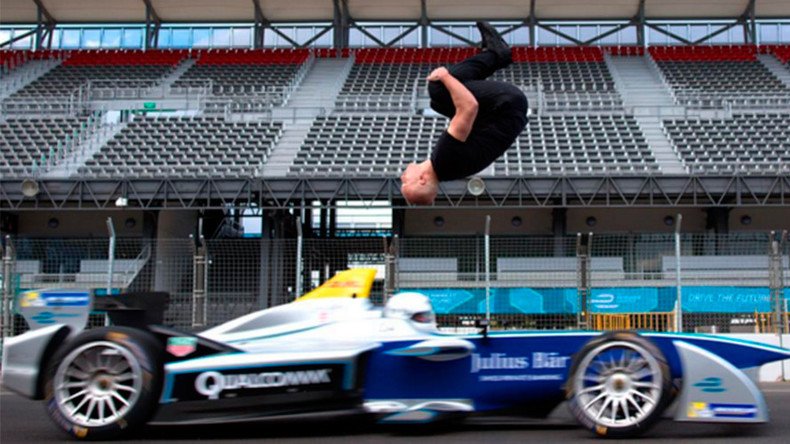 Leap of faith: Stuntman clears speeding race car in ‘blind backflip’ (VIDEO)