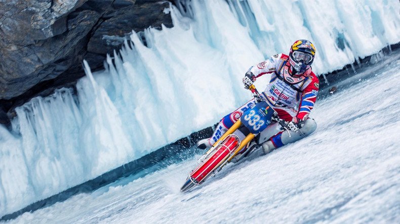 World ice-motorbiking champ dares ride on thawing Lake Baikal… with shaman’s help (VIDEO)