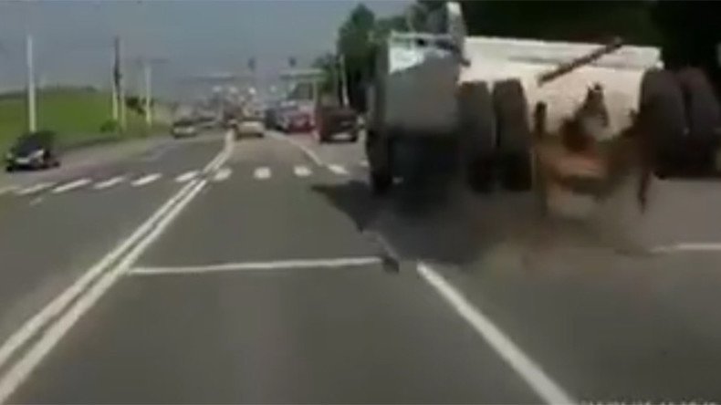 Video shows dramatic moment Russian truck's back wheels fly off on highway