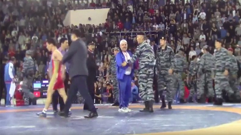 Russian riot police break up mass brawl at wrestling tournament (VIDEO)