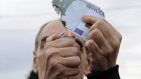 Greek parliament pushes through more austerity measures to unlock bailout cash