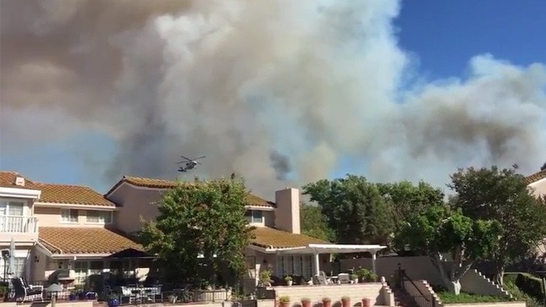 Huge California wildfire threatens homes, evacuations ordered (PHOTOS)