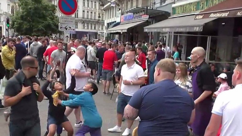 Lille mayhem: English fans throw change at kids in the street to watch them fight over it (VIDEO) 