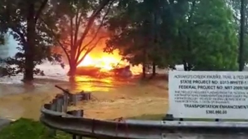 Burning house carried off by West Virginia flood (VIDEO)