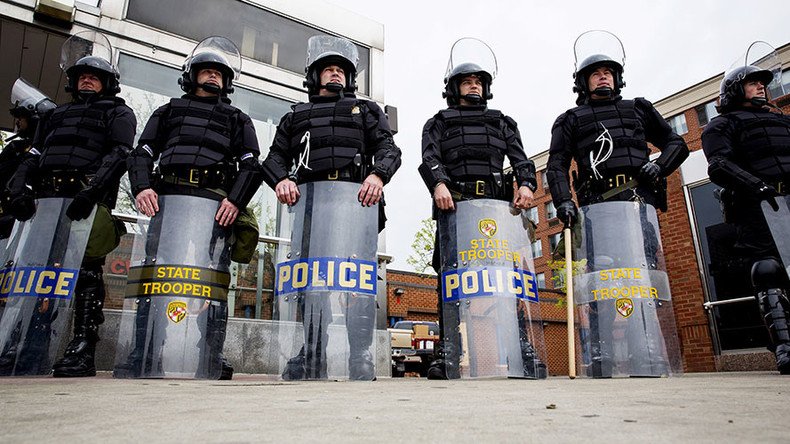 Heavy police presence as Baltimore residents grieve for slain rapper