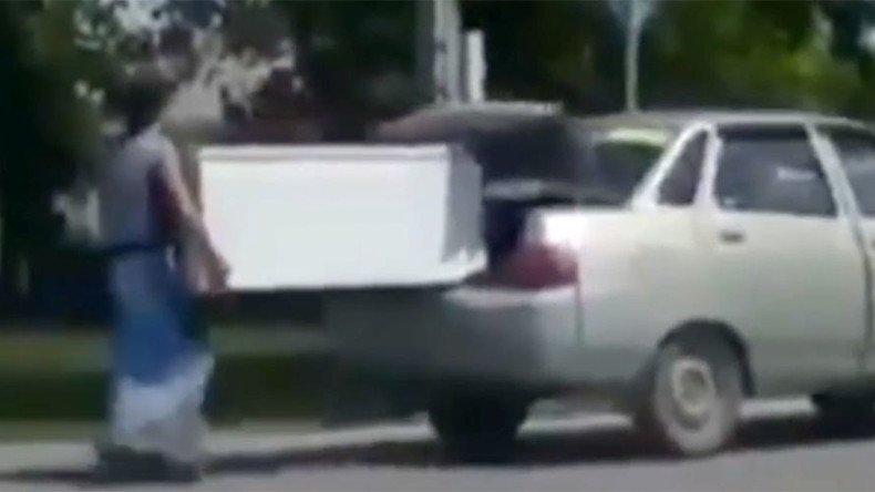 Niiice! Totally Borat moment in Kazakhstan as fiancée proves strength by carrying fridge (VIDEO)