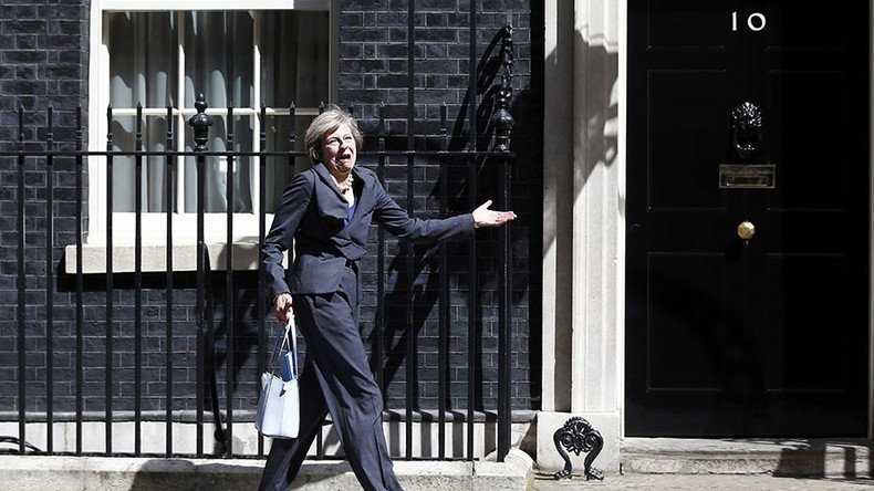 Over here, Theresa: UK's new PM gets muddled up leaving Downing St (VIDEO)