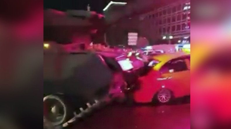 Tanks run over cars in Istanbul as protesters climb onto, block them (VIDEOS)