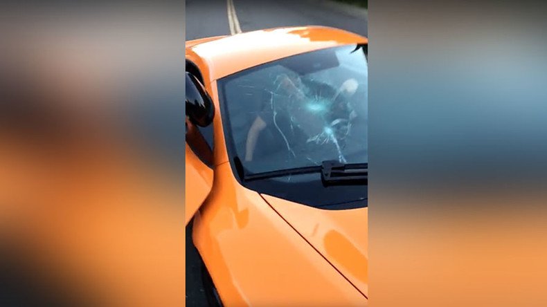 Skateboarder smashes windshield of $250,000 McLaren which nearly knocked him down (VIDEO)