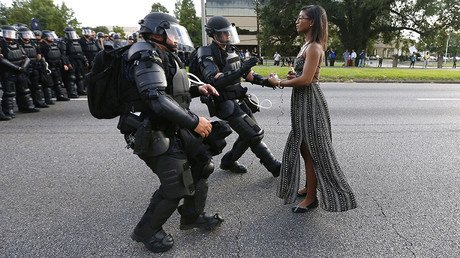 'Gorgeous, legendary': Black woman in flowing dress facing police in Baton Rouge wows social media