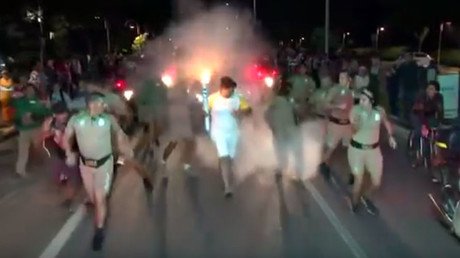Olympic torch bearer attacked by man with fire extinguisher (VIDEO)