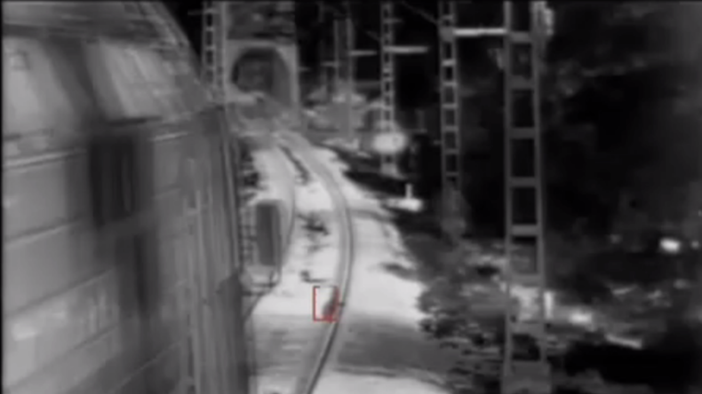 CCTV catches race to save child's life as cargo train hits brakes (VIDEO)