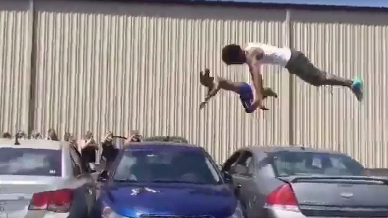 DIY Olympics: Pair of gymnasts trampoline over 3 cars (VIDEO)