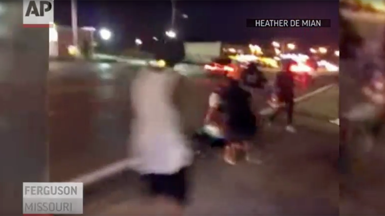 Gunshots heard after car hits Ferguson protester on anniversary of Michael Brown’s death