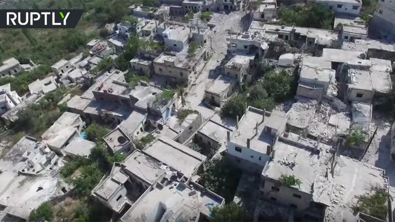 Drone VIDEO shows ruins of Kinsabba town after Syrian army liberates town