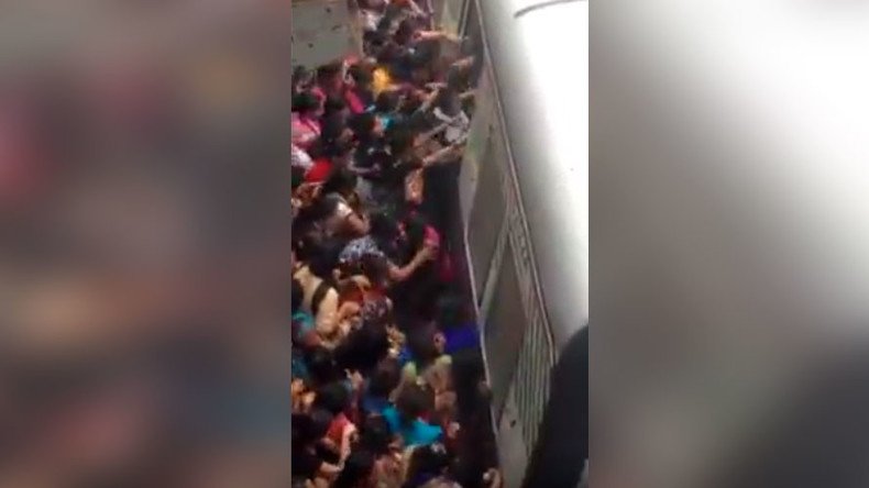 Terrifying crush at Mumbai station sees women fall under train (VIDEO)