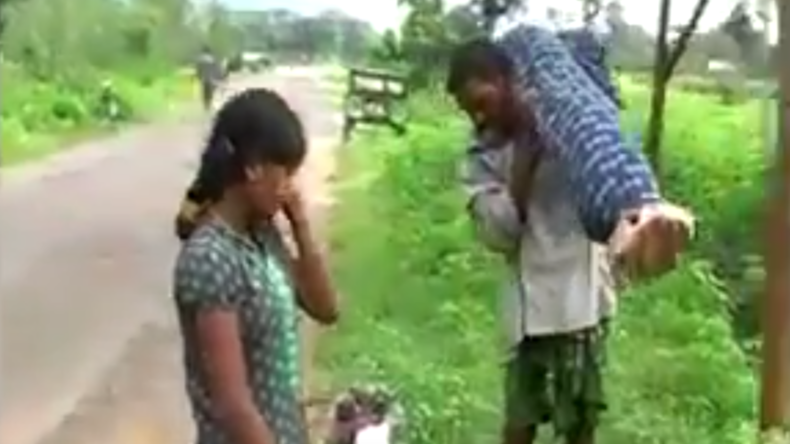 Indian man carries dead wife home from hospital in a final act of love
