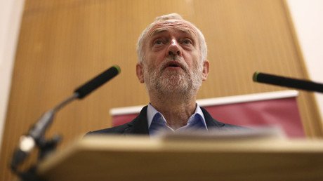 Embattled Labour leader Corbyn sits on floor with commuters for 3-hour train ride