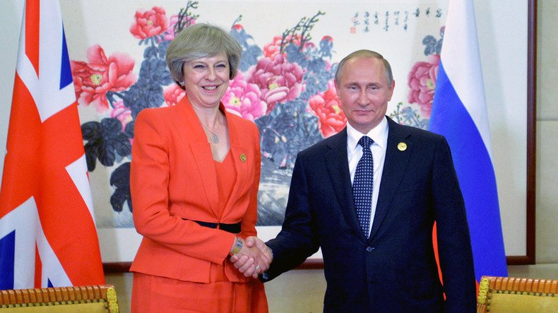 Putin & Theresa May meet for first time, hope to 'resume dialogue'