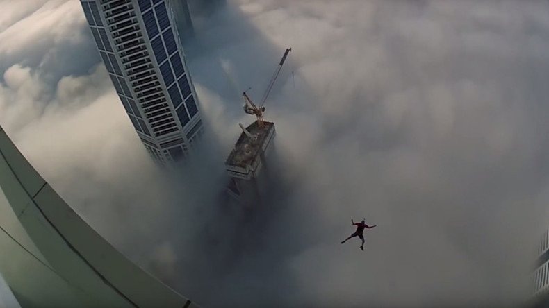 Leap of faith: Dubai base jumper makes blind plunge through clouds (VIDEO)