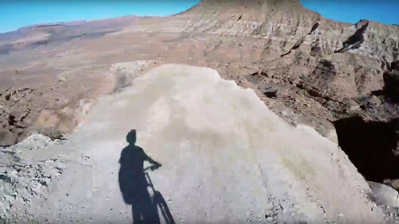 Helmet cam captures mountain biker’s death defying desert jump (VIDEO)