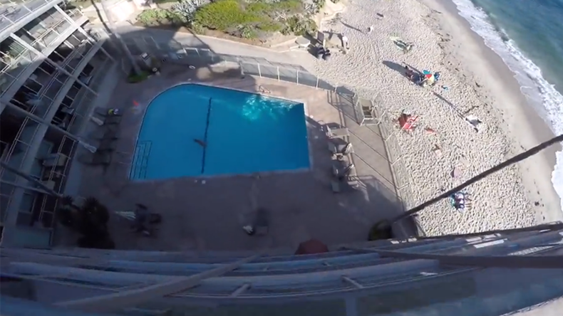 Crazy multi-story swimming pool jump caught on camera (VIDEO)