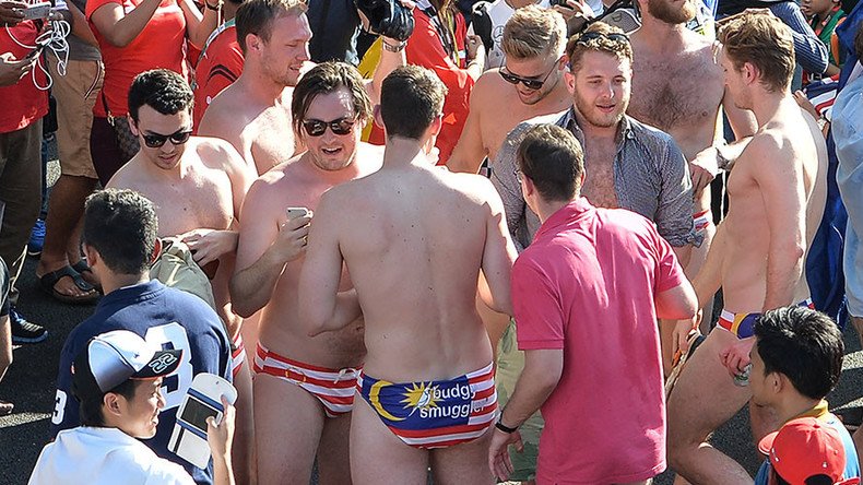 Govt adviser among Australians arrested for stripping to Speedos at Malaysian Grand Prix (VIDEOS)