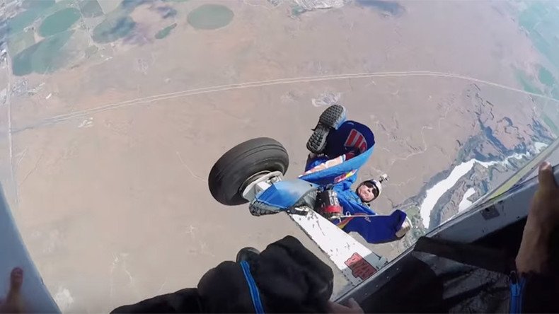 Heartstopping footage captures skydiver trailing from plane in mid-air (VIDEO)