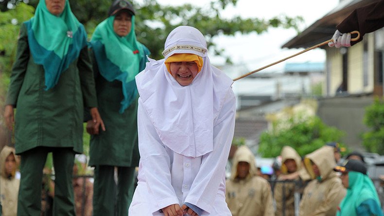 Indonesian woman flogged for standing too close to boyfriend (PHOTOS)