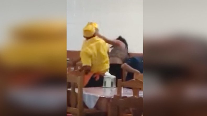 Waiter punches female customer as intervening diners threatened with machete (GRAPHIC VIDEO)