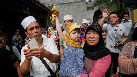 Parents in majority Muslim region of China banned from ‘luring’ children into religion
