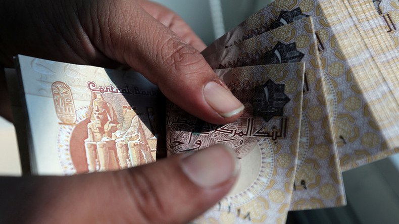 Egypt devalues currency to spur economy and meet IMF loan demand
