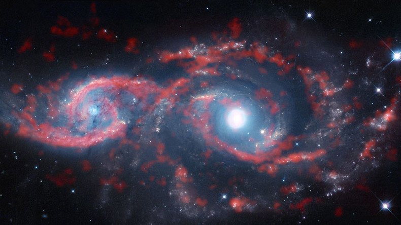 ‘Tsunami of stars & gas’: Galaxies collide in whirling mass of space debris (PHOTOS)