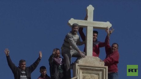Kurdish militias & locals replace cross destroyed by ISIS atop Christian church near Mosul (VIDEO)