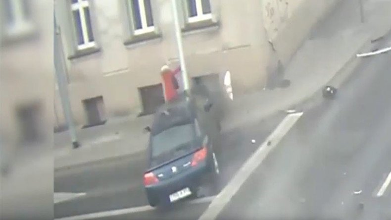 Nerve-shredding footage shows lamp post save woman from runaway car (VIDEO)