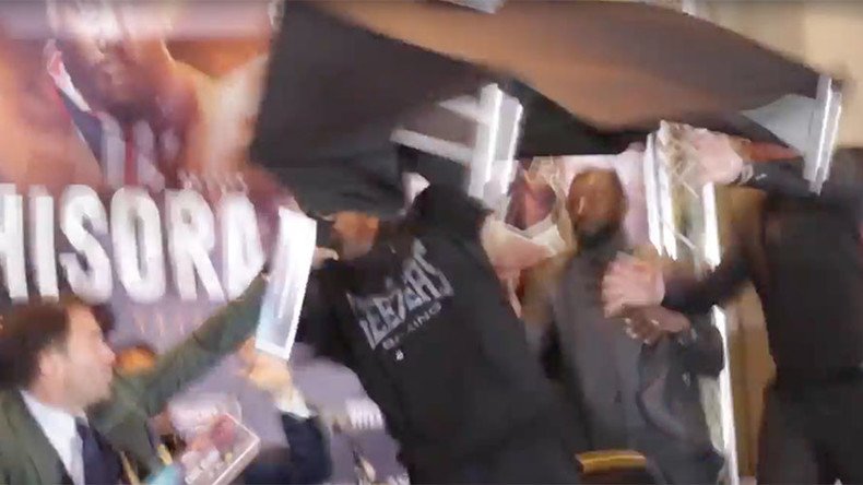 British boxer throws table at opponent as press conference descends into chaos (VIDEO)