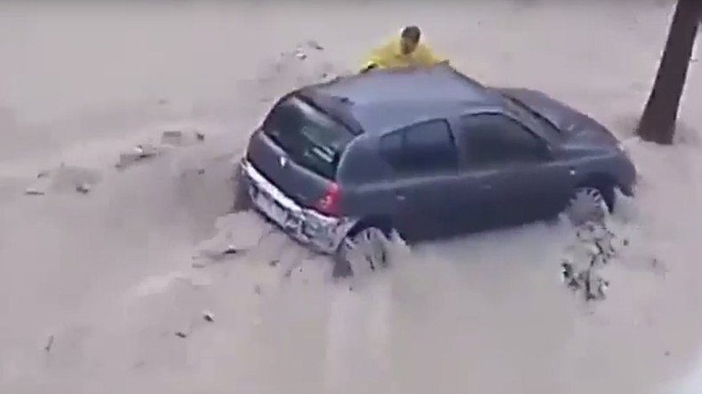 Man swept to his death in violent flood as Spain battles fierce storms (VIDEO)