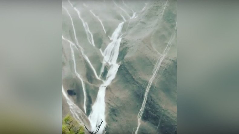 Record-breaking desert rains send waterfalls down Australia’s Ayers Rock (VIDEO)