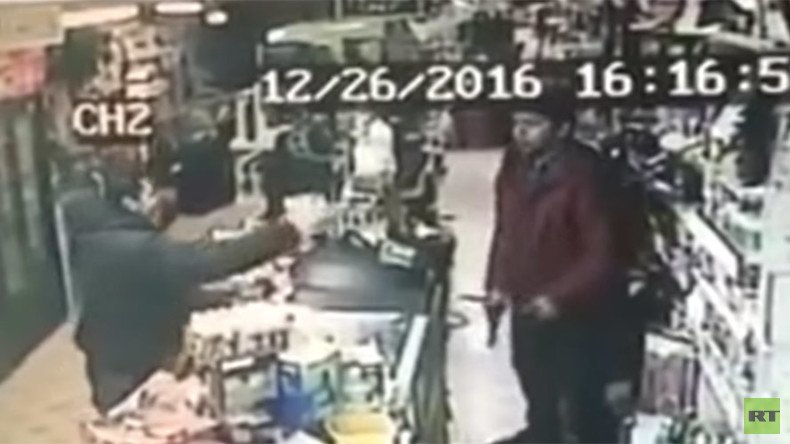 Teenage shop clerk fearlessly snatches gun from armed robber (VIDEO)