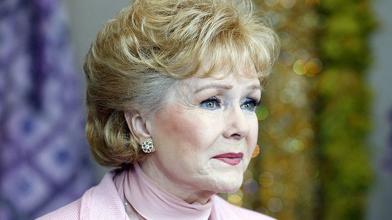 Singin' in the Rain star Debbie Reynolds, mother of Carrie Fisher, dies at 84
