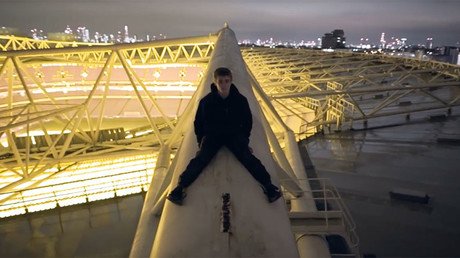 Heart-stopping video shows fearless daredevils scale stadium roof without harness