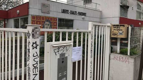 Racist graffiti, swastikas found on Anne Frank school in France